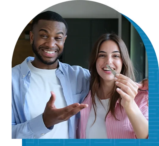 A couple holding the keys to their new home